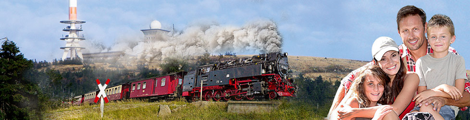 Dampfzug vor Brocken mit Familie